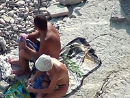 Woman and her man come to sunbathe on the beach and decide to make love 11