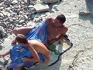 Woman and her man come to sunbathe on the beach and decide to make love 9