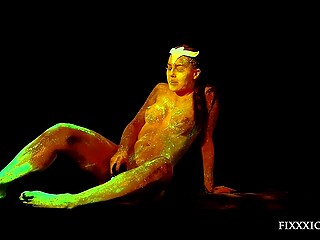 Girl covered with sexy fluorescent sequins makes dildo glow while drilling the pussy