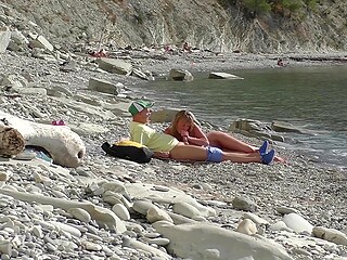 On the Bulgarian beach, tourist finds naked chick and convinces her to give him a quick blowjob